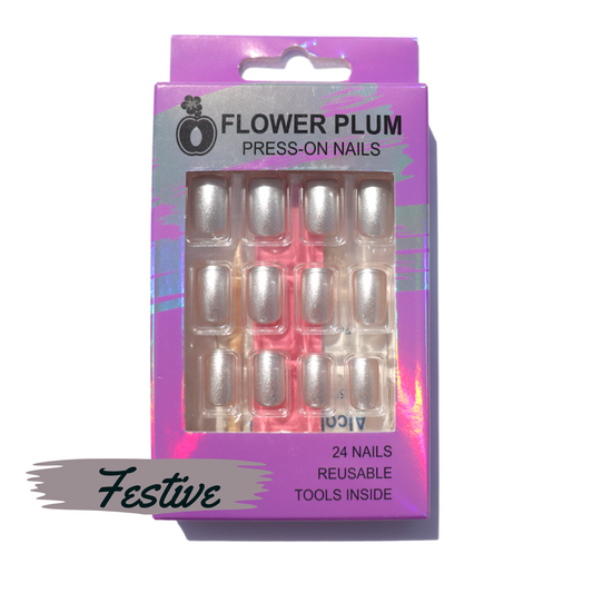 Festive silver short square press-on nails featuring a glittery matte and gloss finish, designed for a natural fit and easy at-home application.